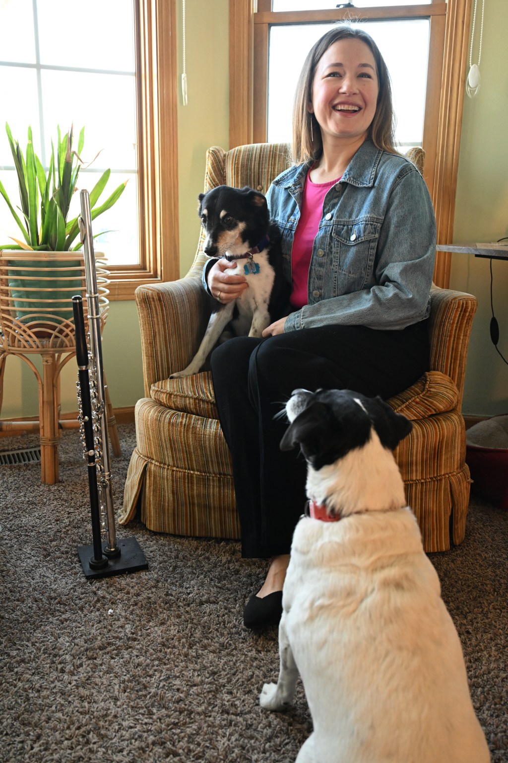 Lindsay with both dogs in her home studio with instruments. Photo by AVDude.