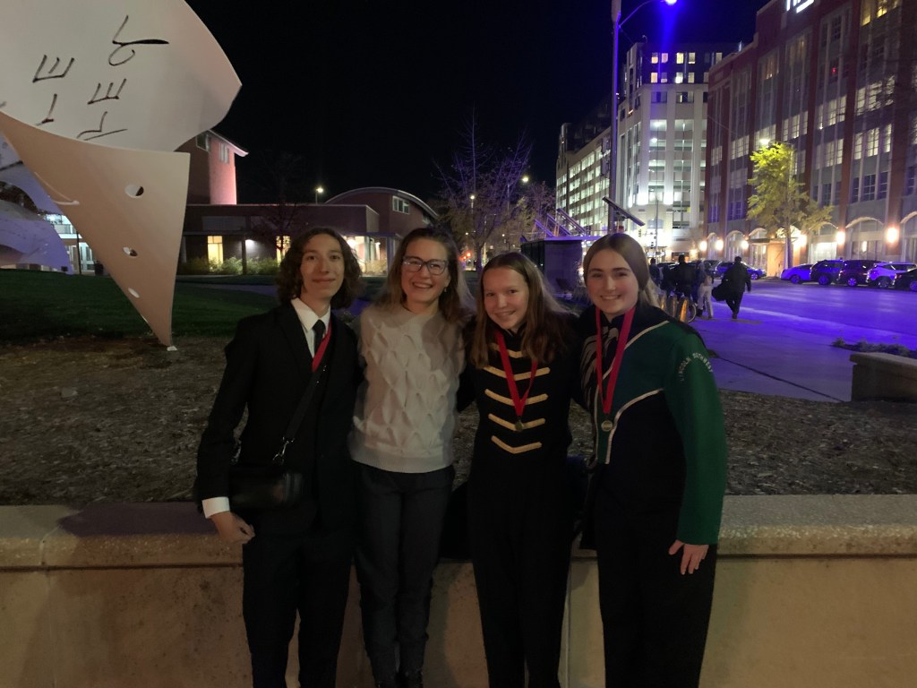 Lindsay with three students who participated in Nebraska All-State band/orchestra, November 2024