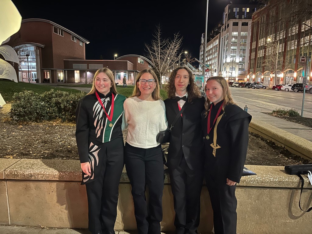 Lindsay with three students who participated in Nebraska All-State band/orchestra, November 2025